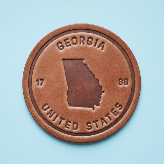 Bronze-colored emblem with 'Georgia' and 'United States' text on a wooden background