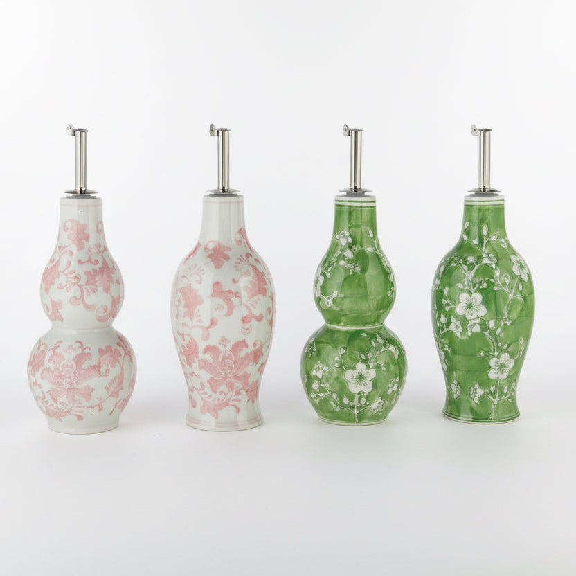 Four decorative bottles with floral patterns on a white background