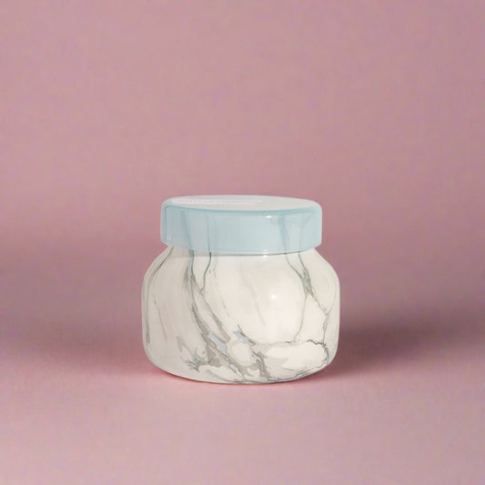 Petite jar candle with an eye-catching design and a soothing Blue Jean fragrance, perfect for adding a tranquil aroma and stylish touch to any room.