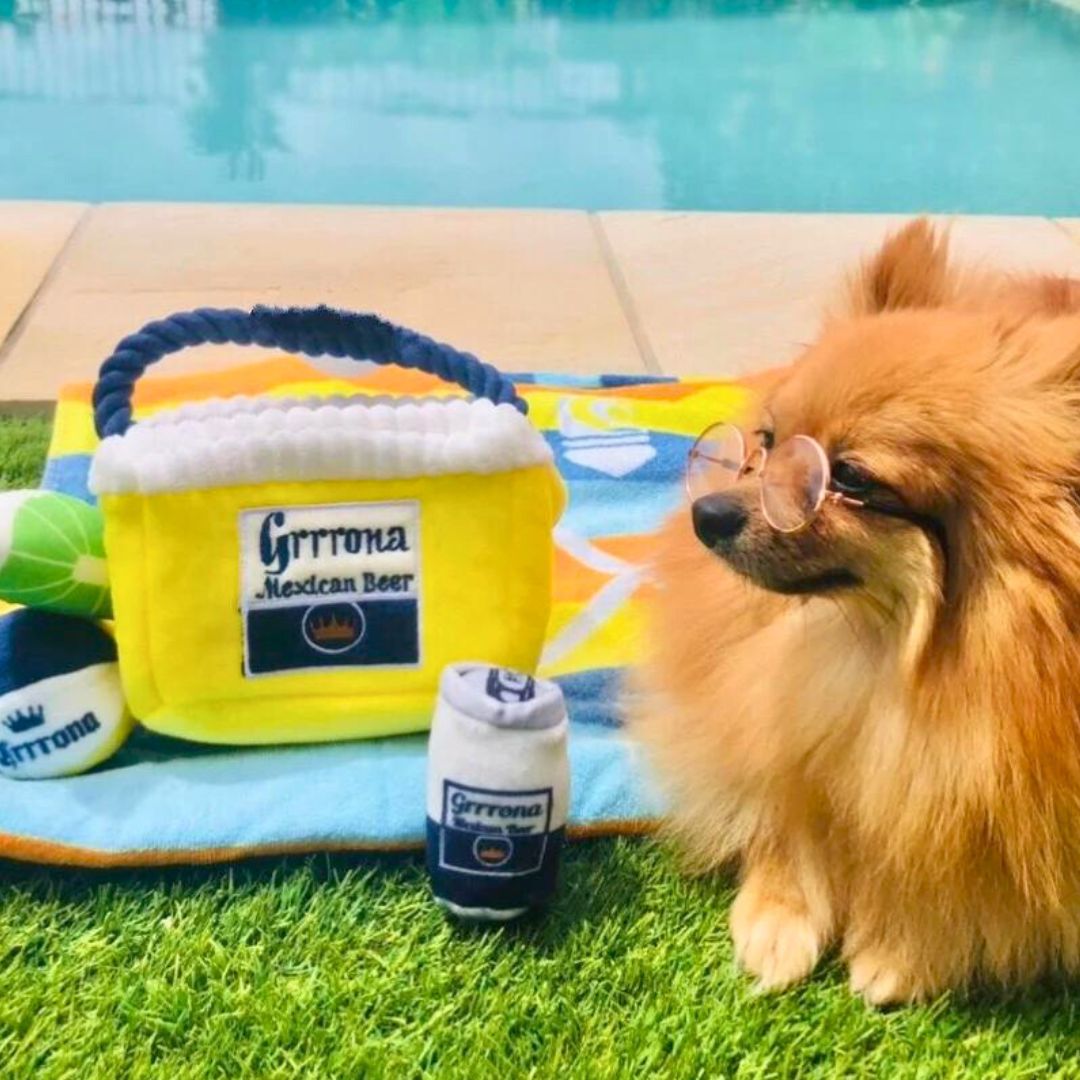 Plush_dog_toy_shaped_like_a_GRRRona_can_with_a_soft_exterior_and_hidden_squeaker_perfect_for_playful_pups_looking_to_add_fun_and_excitement_to_their_playtime.copy