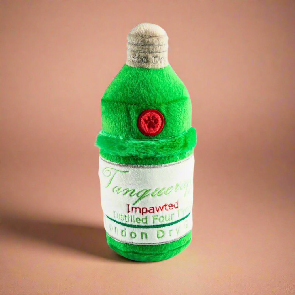 Plush_dog_toy_shaped_like_a_gin_bottle_in_Tanqueruff_green_featuring_a_hidden_squeaker_and_velvety_exterior_perfect_for_playful_pups_and_happy_hour_fun.