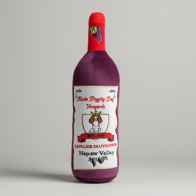 Plush_dog_toy_shaped_like_a_wine_bottle_featuring_a_soft_exterior_and_hidden_squeaker_ideal_for_playful_pups_who_enjoy_a_unique_and_entertaining_play_experience.