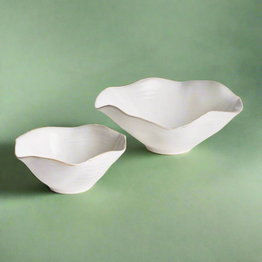 Set of two decorative bowls with a sleek, modern design, ideal for displaying fruit, potpourri, or as stylish accent pieces in any room.
