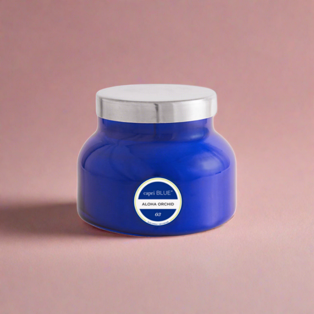 Tropical orchid-scented candle in a decorative container, perfect for creating a relaxing and exotic atmosphere in any room.