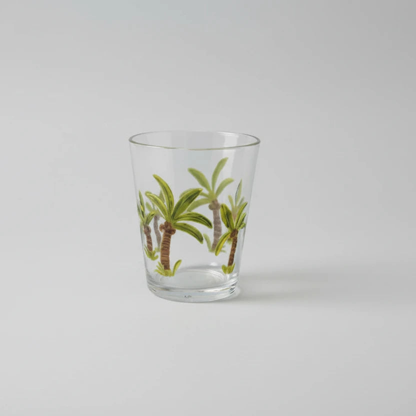 Clear glass with palm tree design on a white background