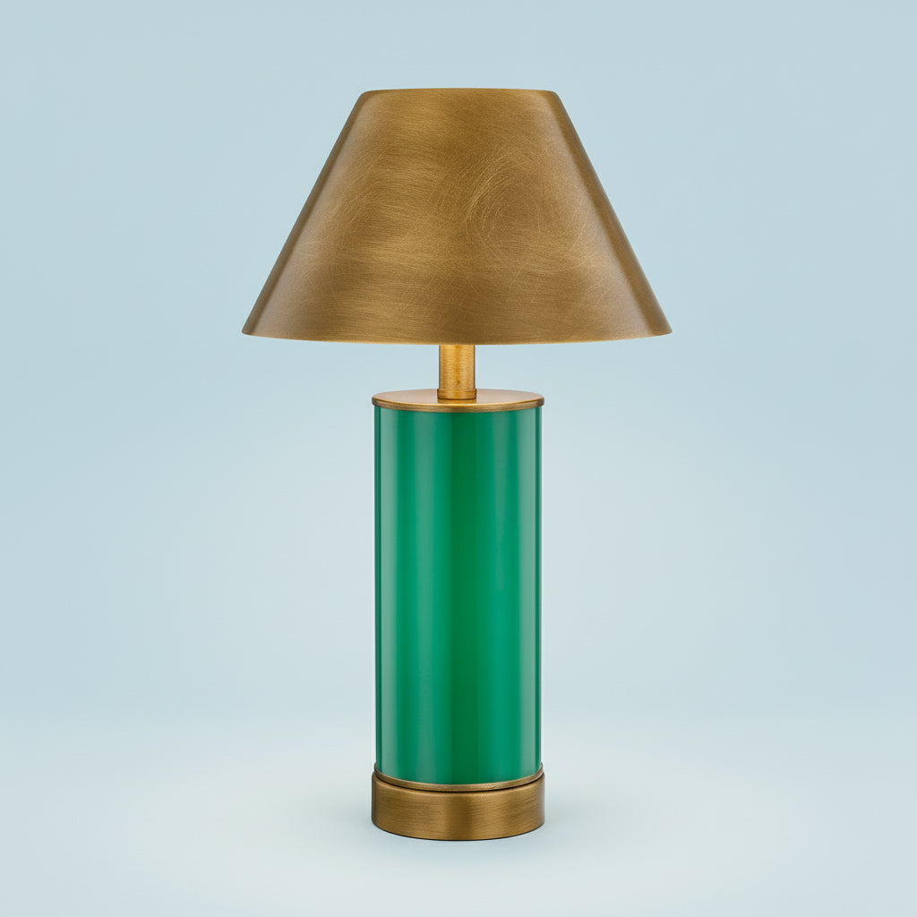 Table lamp with green base and gold shade on a white background