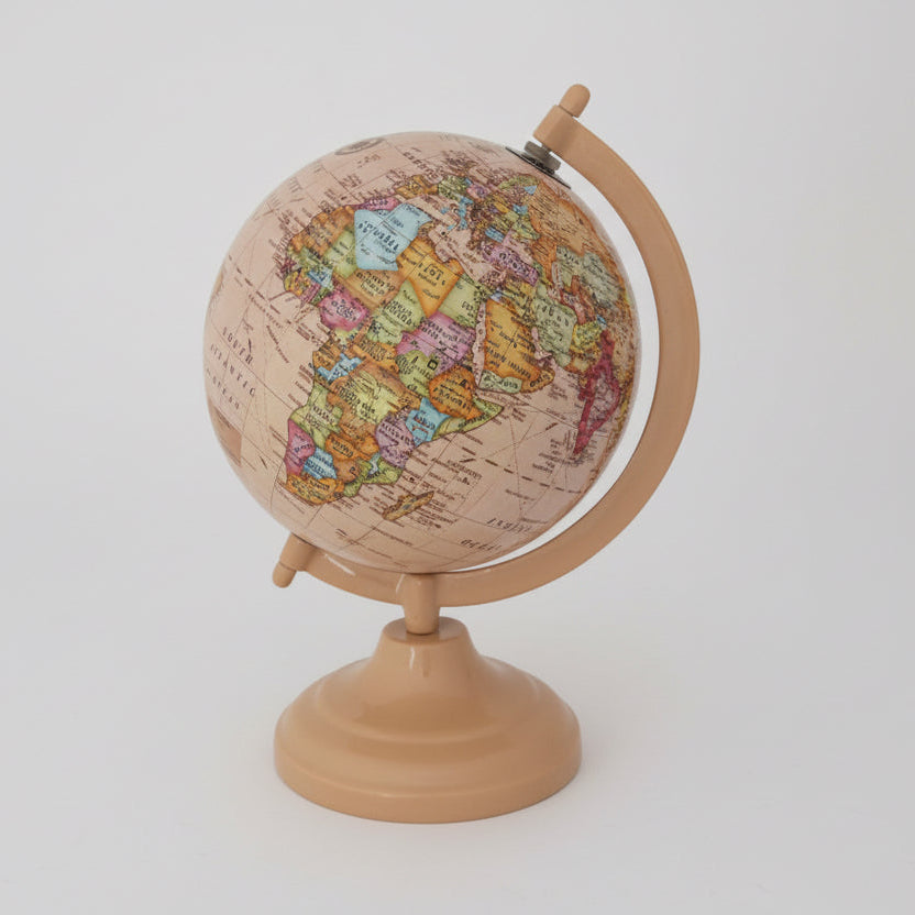 Decorative globe with a wooden stand on a white background