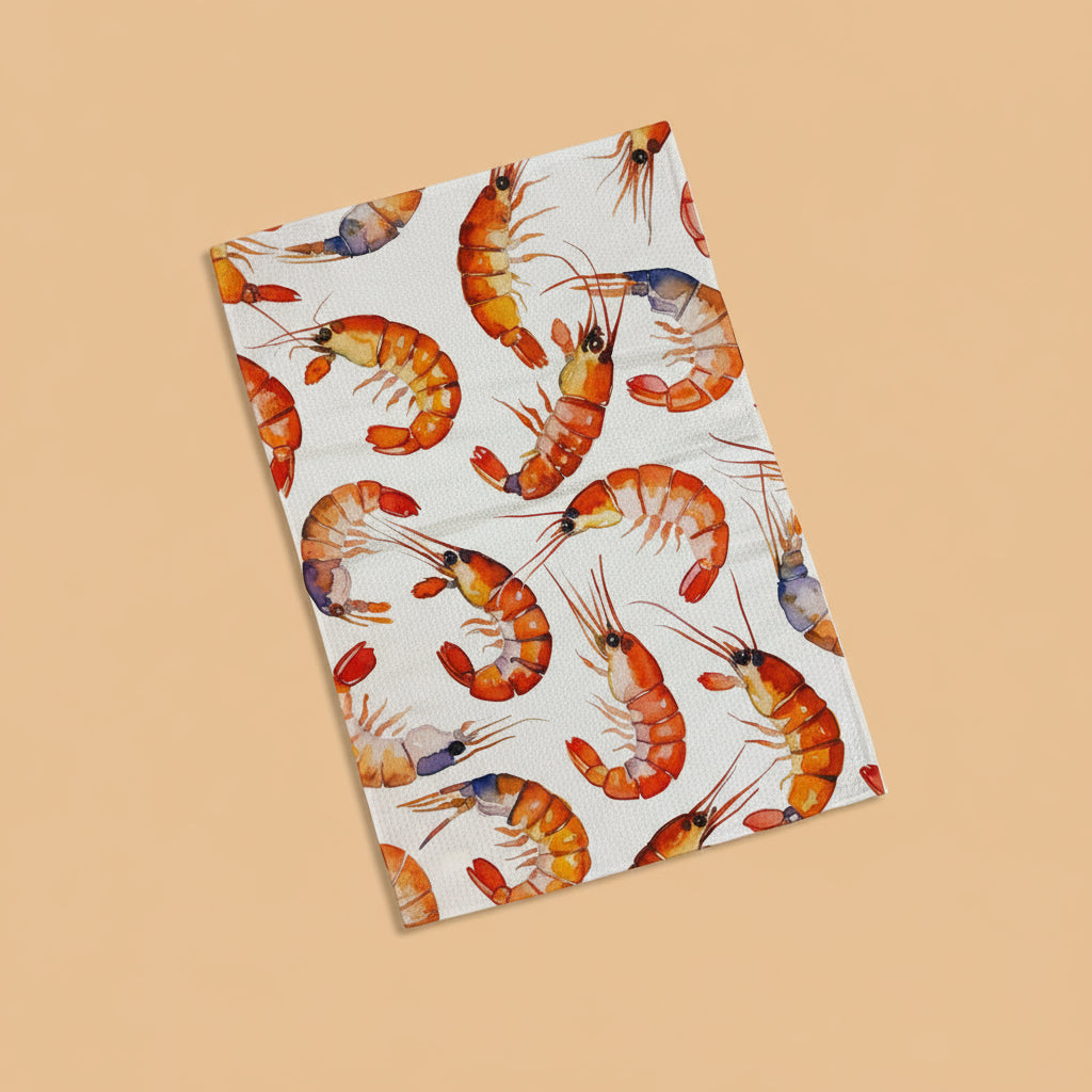 Dish towel with shrimp pattern on a dark surface with vegetables
