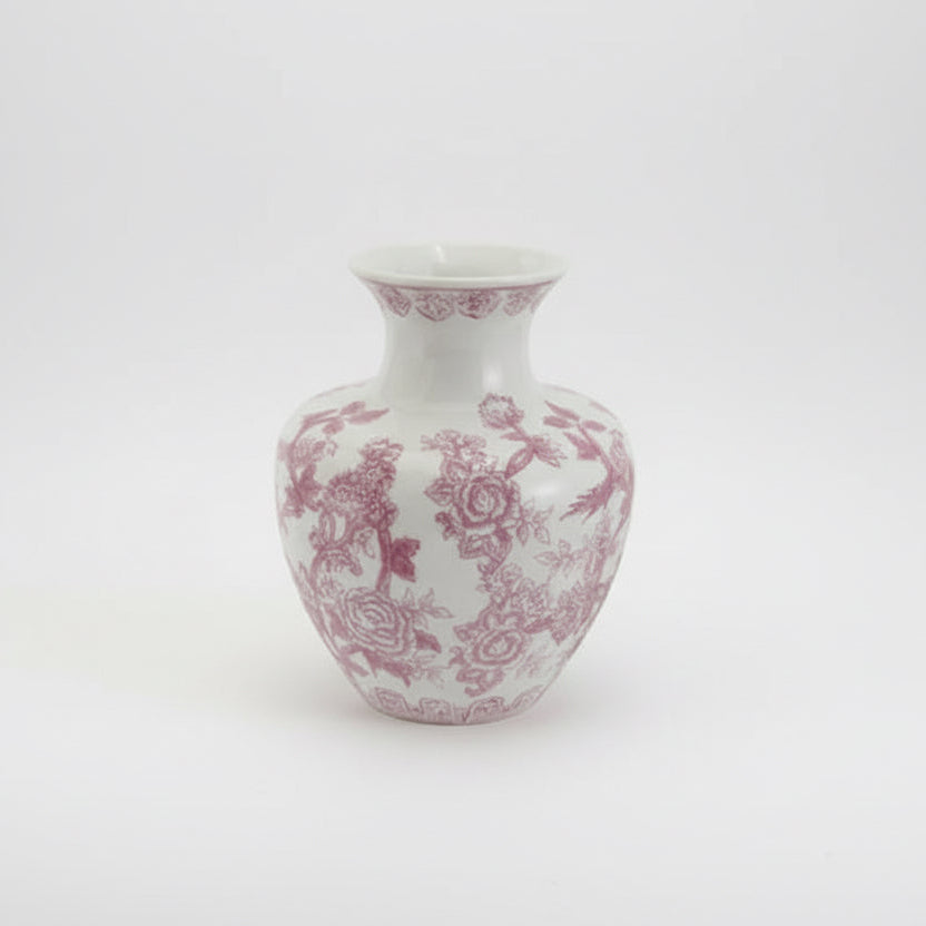 White vase with pink floral pattern on a white background
