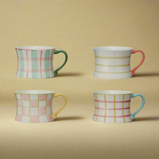 Ahand-printedmugfeaturingavintage_maximalistdesigninpastelcolors_perfectforaddinganeclecticandcharmingtouchtoanykitchen.