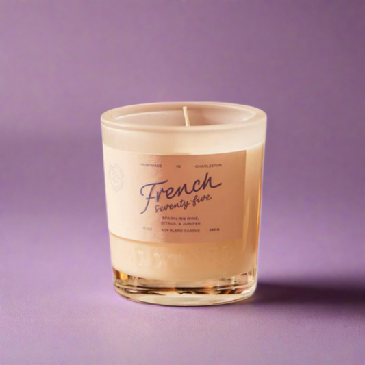 French 75 Candle with sparkling champagne, zesty lemon, and aromatic botanicals, creating a refined, celebratory atmosphere.