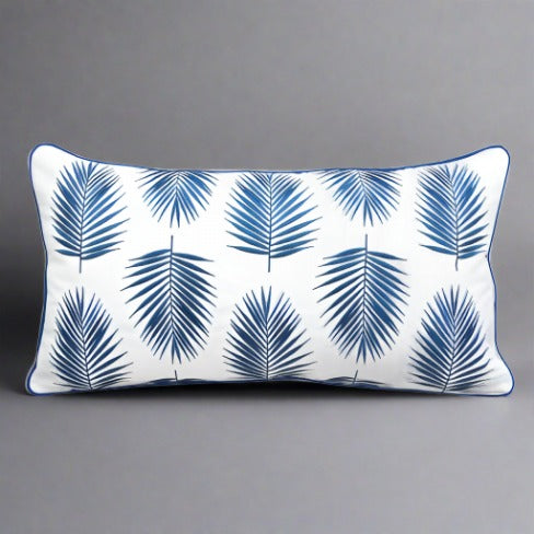 Indoor/outdoor pillow with a green palm pattern, designed for durability and weather resistance, perfect for adding a tropical touch to patios, living rooms, or sunrooms.