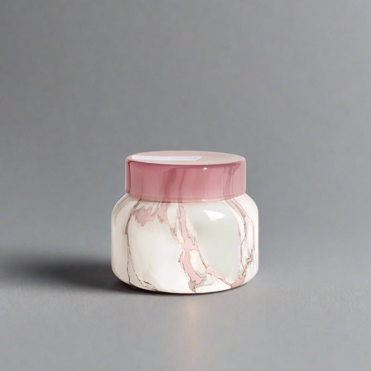 Marble candle infused with Aloha Orchid fragrance, designed to add coastal elegance and a tranquil aroma to any room, creating a serene and sophisticated ambiance.