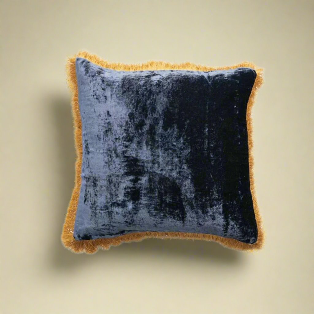 Navybluevelvetpillowwithasoft_luxuriousfeel_designedtoaddeleganceandcomforttoasofa_chair_orbed.