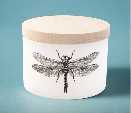 Ocean Breeze Citronella Triple Wick Candle in a matte white vessel with a maple wood lid, featuring natural citronella oil blended with ocean air and hints of jasmine, grapefruit, lemon, and lime for a refreshing, bug-repelling fragrance.