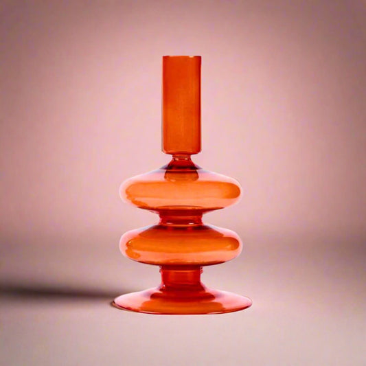 Orangeretroglasscandleholder_perfectforaddingaplayfulandnostalgicaccenttoanytableorshelf_enhancingtheambiancewithawarm_cozyglow.