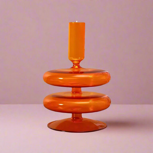 Orangeretrowavyglasscandleholder_designedtoaddavibrant_vintagetouchandwarmglowtoanytabletopordecorsetting.