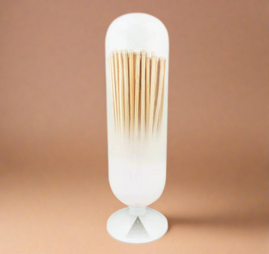 Introducing our White Cloud Match Cloche, a delightful way to display your matches in style. Hand-blown from glass, this match cloche exudes elegance and charm, making it a perfect addition to any home decor.