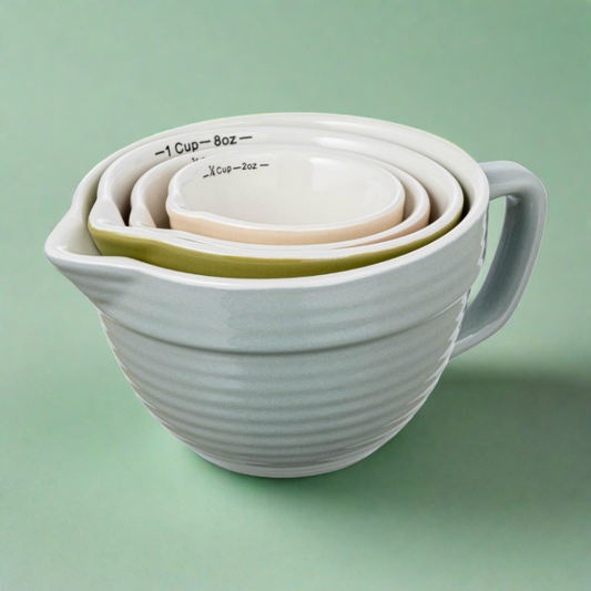 Set of colorful stoneware measuring cups, ideal for adding a vibrant touch to kitchen tasks while providing accurate measurements for cooking and baking.