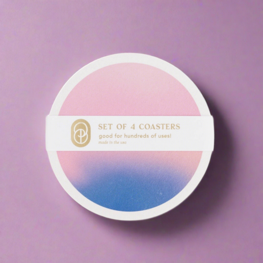 Set of four coasters featuring a pink and blue gradient design inspired by sunrise, made from eco-friendly chipboard with UV-resistant ink, ideal for adding a stylish and protective touch to your table.