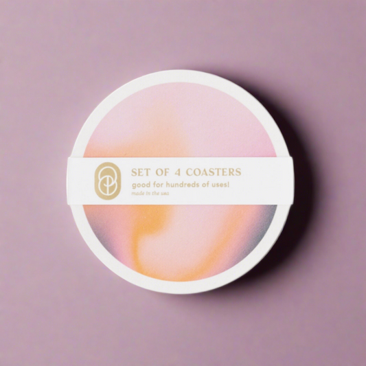 Set of sustainable coasters with celestial designs, made from eco-friendly materials, perfect for adding a cosmic touch to any table while protecting surfaces.