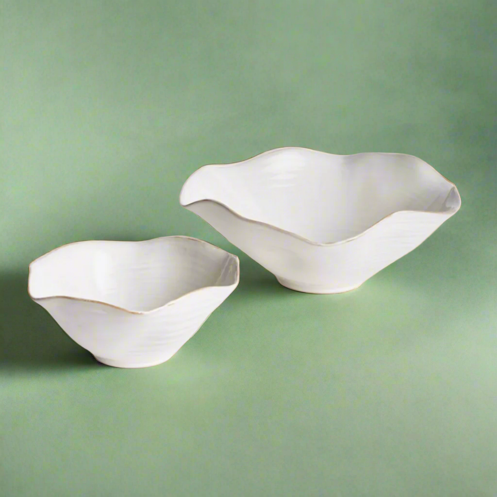 Set of two decorative bowls with a sleek, modern design, ideal for displaying fruit, potpourri, or as stylish accent pieces in any room.