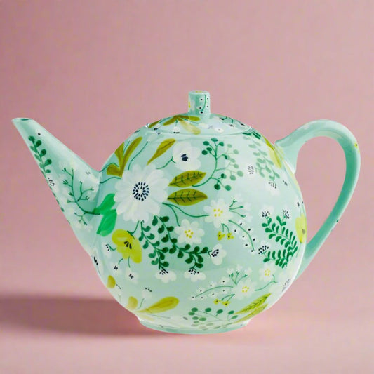 TheFlowerPowerTeapotaddsacheerfulfloralflairtoyourtearitual.Itsvibrantdesignandclassicshapemakeitperfectforservingteawithstyleandatouchofwhimsy.