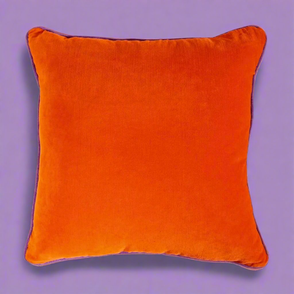 Vibrant_orange_pillow_with_a_soft_fabric_and_plush_filling_ideal_for_adding_a_dynamic_colorful_accent_to_sofas_chairs_or_beds_in_eclectic_and_modern_decor.