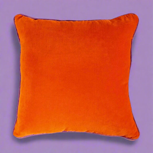 Vibrant_orange_pillow_with_a_soft_fabric_and_plush_filling_ideal_for_adding_a_dynamic_colorful_accent_to_sofas_chairs_or_beds_in_eclectic_and_modern_decor.