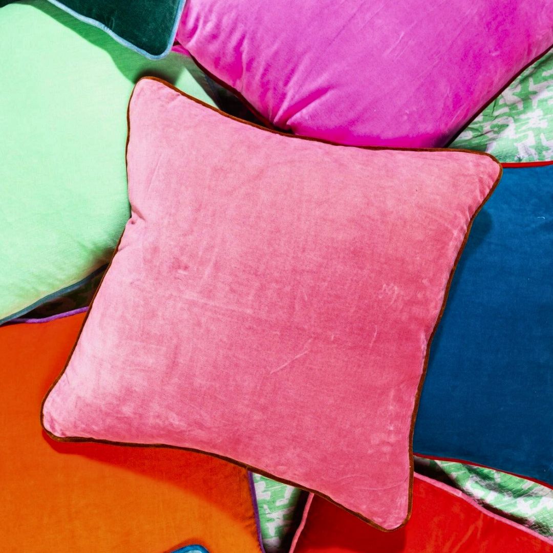 Vibrant_orange_pillow_with_a_soft_fabric_and_plush_filling_ideal_for_adding_a_dynamic_colorful_accent_to_sofas_chairs_or_beds_in_eclectic_and_modern_decor.copy
