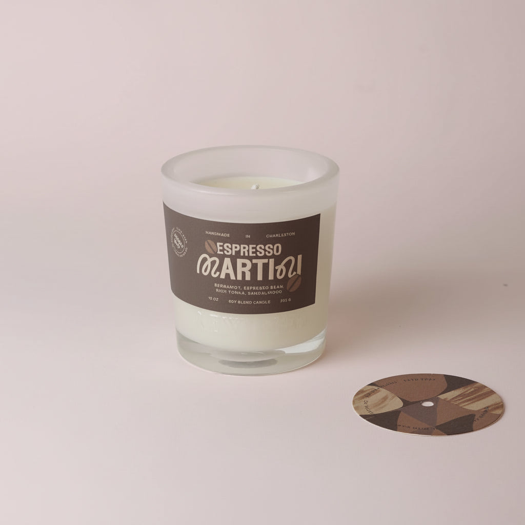 Neutral 10oz candle in a glass vessel positioned on a table, styled for a warm and cozy atmosphere.