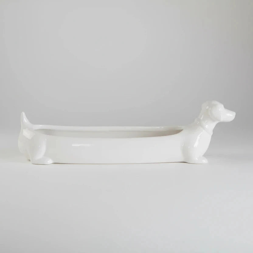 White ceramic dog-shaped planter on a white background