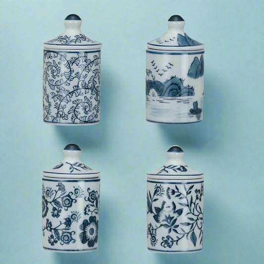 Hand-painted blue and white stoneware spice jar with crackle glaze finish.