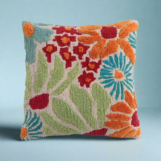20-inch square tufted pillow with floral design, styled for indoor or outdoor seating.
