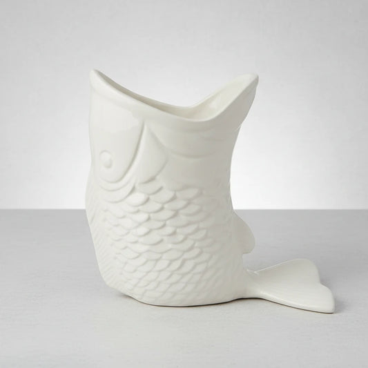 Decorative fish-shaped vase on a white background