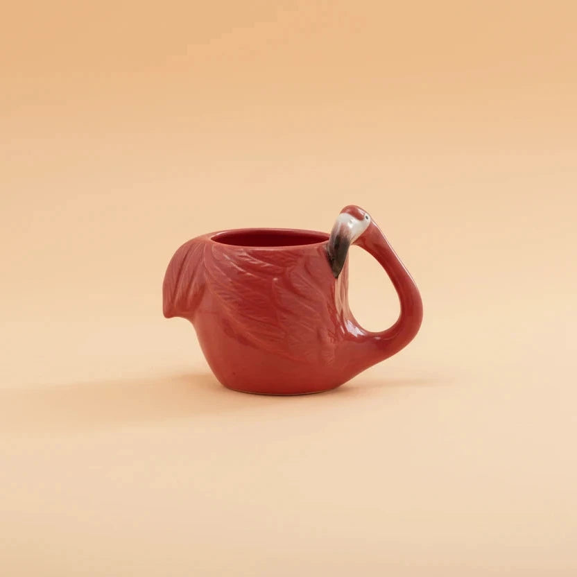 Red ceramic teapot on a white background