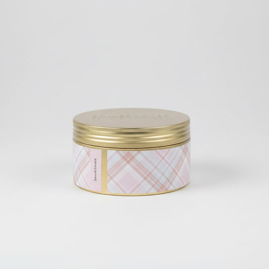 Jar with gold lid and plaid pattern on a white background