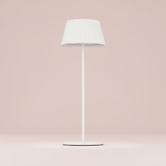 White floor lamp with a white shade on a white background